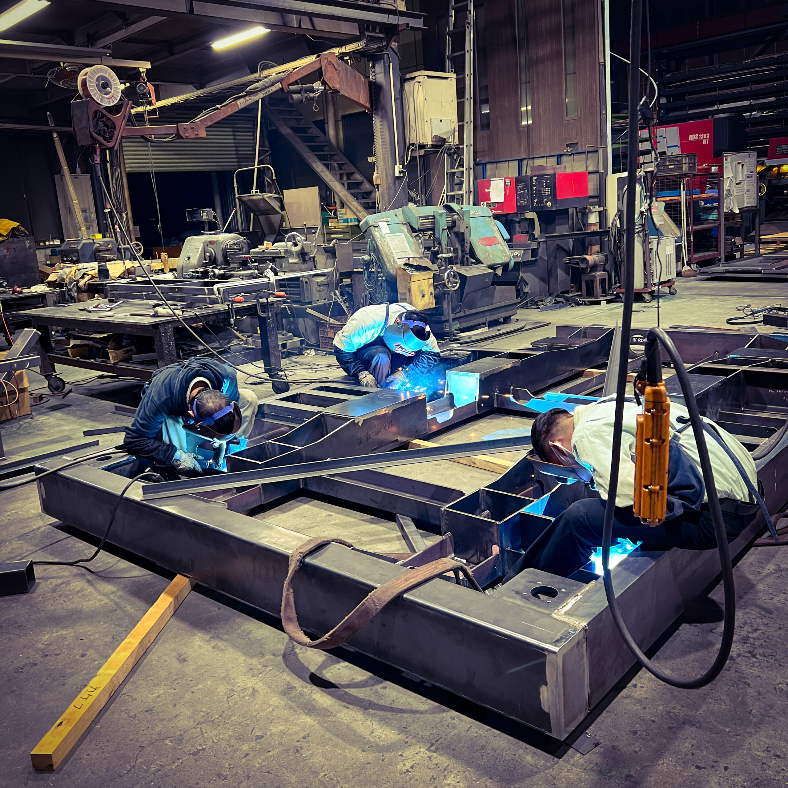 SEIKO craftspeople welding a large metal assembly
